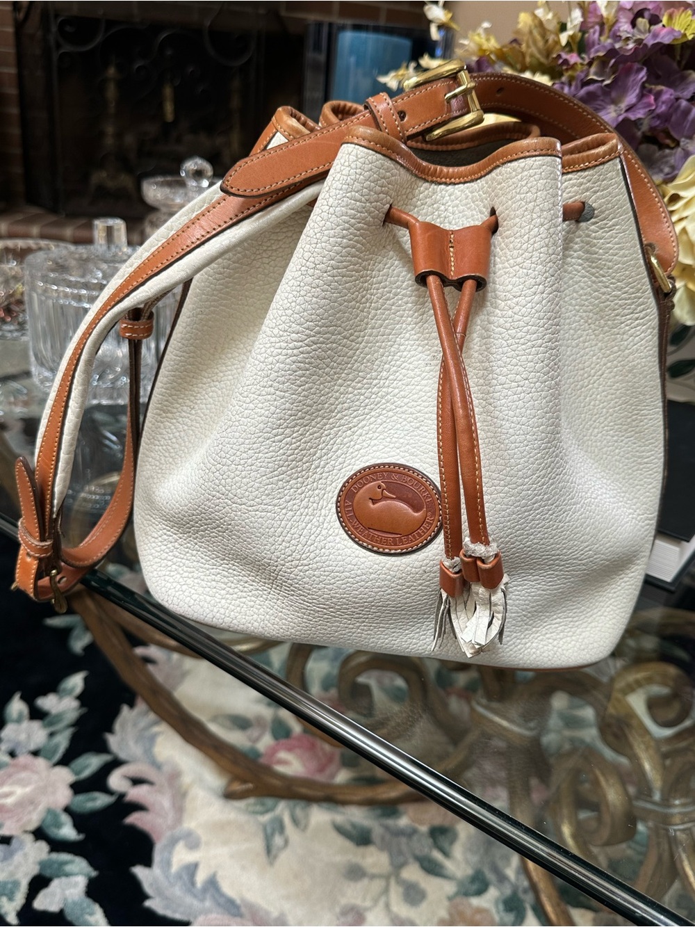 Dooney & Bourke White and Tan Pebbled Leather Drawstring Bucket Bag
